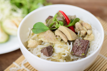 Thai food, rice noodles with green curry chicken (Kanom Jeen Kang Keaw Wan Gai)