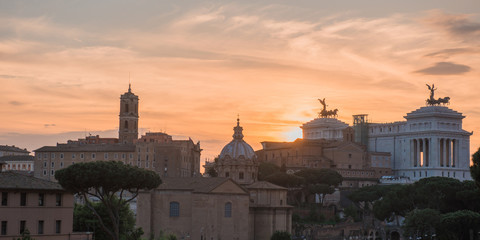 Fototapeta na wymiar sunset with the Roman forum d background