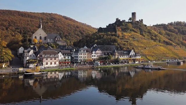 Flight over Beilstein town and autumn vineyards, Mosel valley, Germany.