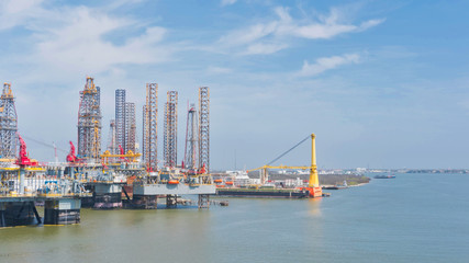 Fototapeta na wymiar Oil rigs close to the port