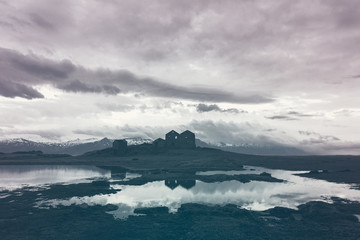 Dramatic weather over Icelandic ruins at dusk