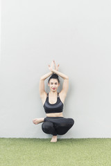 Healthy Yoga at home. Beautiful woman doing yoga pose and meditation.