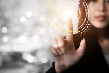 Close up of finger pointing to screen with technology icons. Business and future technology background concept.