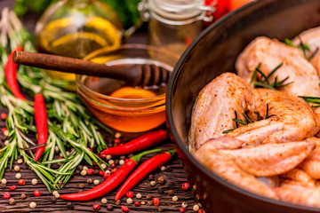 Chickens wings covered in honey, vegetables