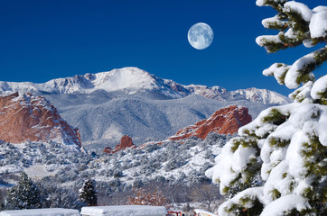 Snow capped Pikes Peak at the Garden with moon