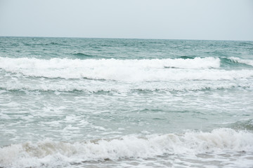 beautiful beach with waves in the nature of the background