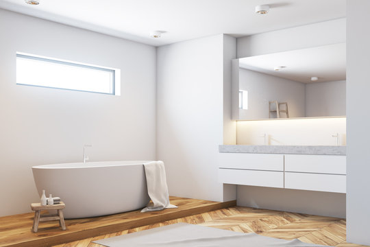 White bathroom corner, white tub, wood