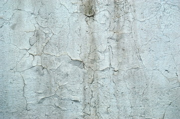 An old dirty wall with cracked paint.