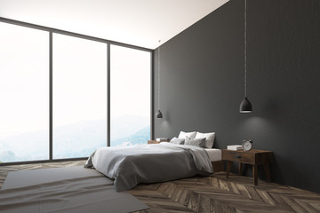 Corner of a panoramic gray bedroom interior