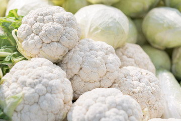 Fresh ripe cauliflower for sale in a market. Group of cauliflower