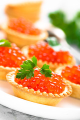 Tartlets with red salmon fish caviar, salmon caviar. Caviar
