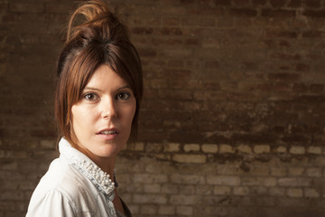 A beautiful redhead girl on ocher fonde