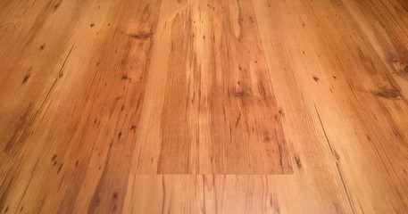 Light brown soft wood floor surface texture as background, wooden parquet. Old grunge washed oak laminate pattern top view.