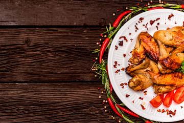 Chicken wings grilled with spices and chili pepper