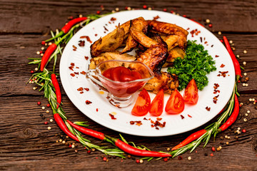 Chicken wings grilled with spices and chili pepper