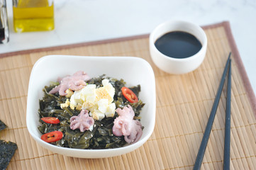 salad from sea kaleuropa octopus, eggs and onions