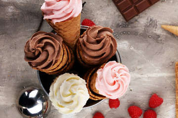 Vanilla frozen yogurt or soft ice cream in waffle cone.