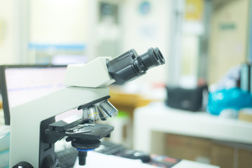 Close up microscope in lab.
