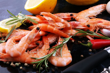 Raw fresh Prawns Langostino Austral. shrimp seafood with lemon and spices.
