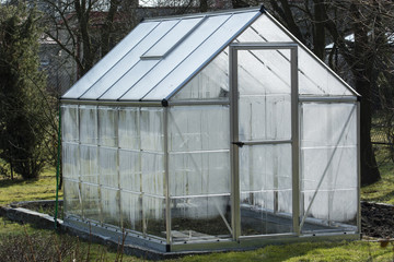 Plastic dewatered greenhouse in the garden.