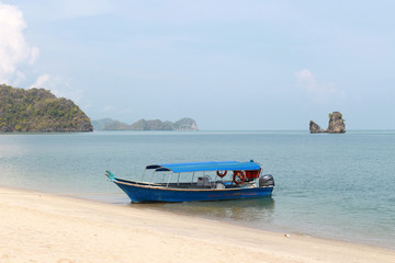 Fototapeta na wymiar Fishing boats at the shore of Langkawi island, Malaysia