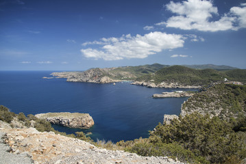 Landscape view off cliffs on Ibiza in vibrant summer sun