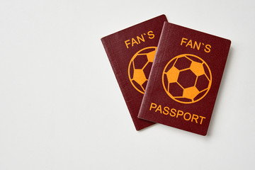 Two abstract fan passports on white table