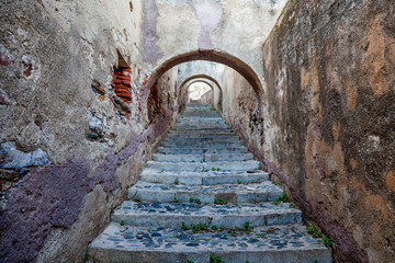 stone staircase in an old castle, French European medieval architecture © olezzo