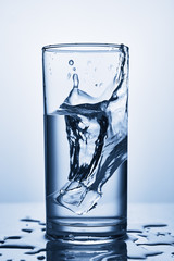 water splash in glasses isolated on white