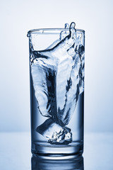 water splash in glasses isolated on white