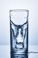 water splash in glasses isolated on white