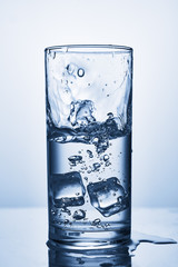 water splash in glasses isolated on white