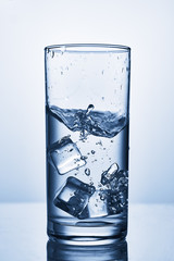 water splash in glasses isolated on white