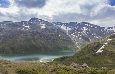 Panoramic view of Norwegian fjords under gray clouds