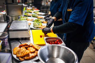 chef cuts cherry tomatoes