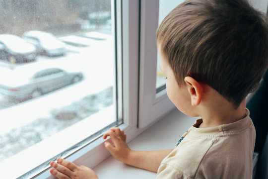 The Boy Looks Out The Window