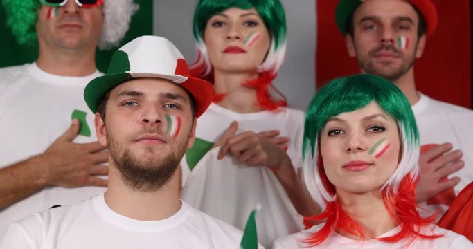 People Crowd of Italian Supporters Listening with Hand on Heart National Anthem