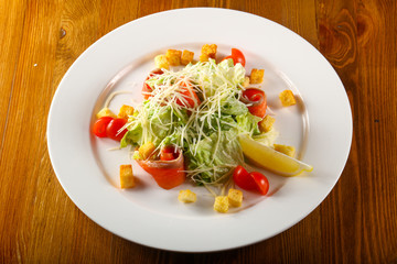 Caesar salad with salmon