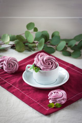 Homemade marshmallows on a light background. Russian stavberry, vanila and lavender zephyr. Selective focus. Marshmallov