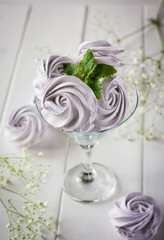 Homemade marshmallows on a light background. Russian stavberry, vanila and lavender zephyr. Selective focus. Marshmallov