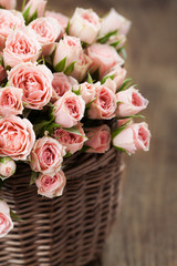 Bouquet of pink spray roses in basket