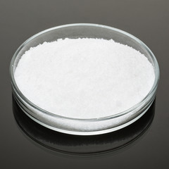 hydro-gel powder in glassware on a dark surface