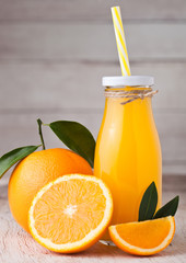 Glass bottle of raw organic fresh orange juice
