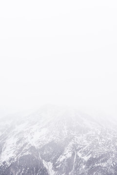 Fototapeta Snowfall in the Alps. Snow mountain and fog