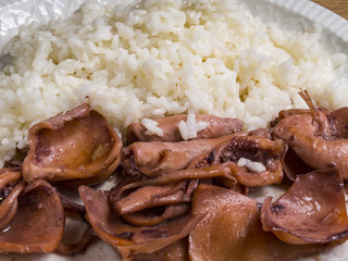 Stewed squid with white rice in the plate