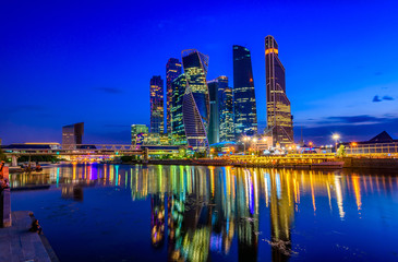 Obraz na płótnie Canvas Skyscrapers of Moscow City business center and Moscow river in Moscow at night, Russia