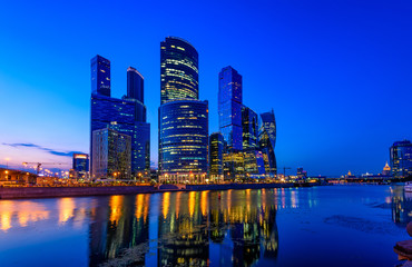 Skyscrapers of Moscow City business center and Moscow river in Moscow at night, Russia
