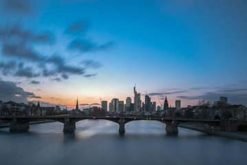 Fototapeta premium The skyline of the banking metropolis in Frankfurt am Main during a beautiful sunset. Frankfurt, Germany / 26 February 2018