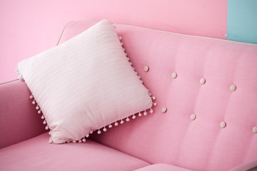 pink pillow on sofa in living room