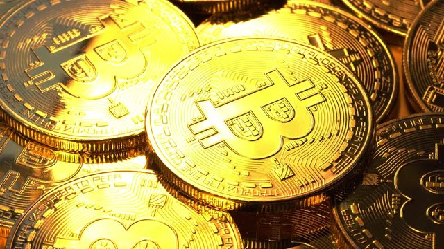 Gold coin bitcoin slowly scroll clockwise. Macro shot. 4K video.